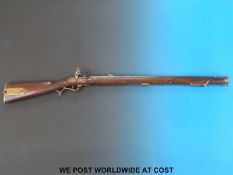 Baker hammer action flint lock smooth bore rifle with brass mounts, trigger guard and butt plate,