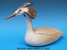 A finely crafted studio pottery grebe marked MT with a stylised monogram underneath,