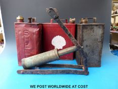 Three vintage two gallon petrol cans and a foot pump