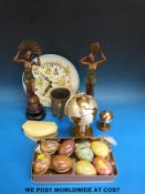 A collection of alabaster eggs, a globe cigarette lighter and matching holder,