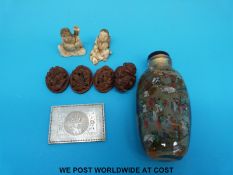 Two Japanese ivory netsukes, a mother of pearl gaming counter,