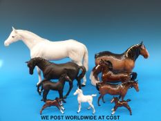 A collection of brown Beswick horses and foals, grey foal,