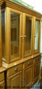 A pine display cabinet or dresser with glazed upper section,