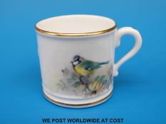 A Royal Worcester miniature mug hand decorated with a blue tit,