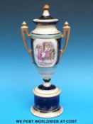 A Vienna style twin handled covered vase with beehive mark to base (33cm tall)