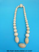 A graduated ivory bead necklace