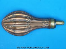 A Dixon & Sons copper embossed powder flask (length 21cm)