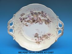 A KPM Berlin two handled dish decorated with birds and blackberries (30cm in diameter)