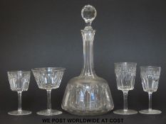 A suite of cut glass ware comprising two decanters, 9 wine glasses, 9 small wine glasses,