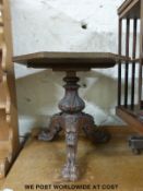 An octagonal table with carved Victorian tripod base (W55 x H52cm)