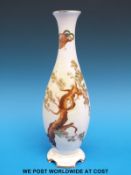 A Royal Doulton vase decorated with a pine tree (26cm tall)
