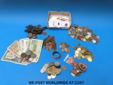 A collection of coins including Roman, Chinese, Victorian, world banknotes, coins,