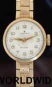Rolex Precision 9ct gold ladies wristwatch with gold hands and Arabic numerals on integral 9ct gold