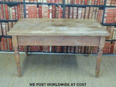 A scrubbed pine three plank kitchen table (H74 x L137 x W80cm)