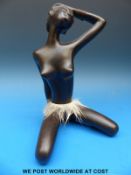 A sculpture of an African woman by Leopold Anzengruber,