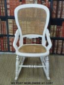 A painted bergere rocking chair