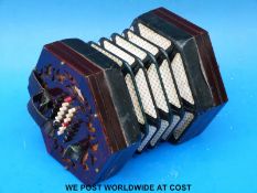 A George Case English concertina, forty eight ivory buttons, fretwork rosewood ends,