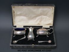 A cased hallmarked silver three piece cruet set (200g weighable silver)