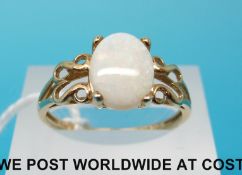 A 9ct gold ring set with oval opal cabochon (size R)