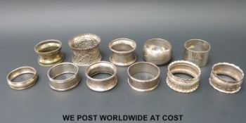 Ten various hallmarked silver napkin rings and another marked sterling (180g)