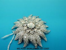 A white metal metamorphic brooch / pin, the central rose cut diamond of approximately 1.