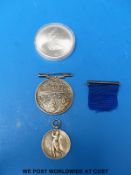 A silver Caledonian curling medal in case,