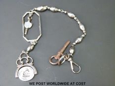 An 18thC cut steel chain or Albert with suspended and framed watch key and a swivel fob with a swan