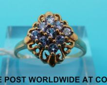 A 9ct gold ring set with blue/purple topaz (size R)