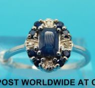A 9ct white gold ring set with sapphires and diamonds (size Q)