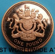 A deluxe cased 2008 UK Royal Arms £1 gold proof coin, certificate no 0143. 19.61g, 22ct gold.