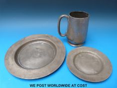 Two pewter plates,one possibly 18thC with touch marks verso,