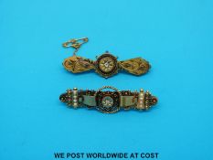 Two yellow metal brooches set with diamonds in star settings, one marked 9ct the other 15ct (7.