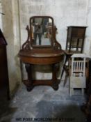 A Victorian mahogany dressing table with lift-up top,