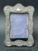 A silver embossed photograph frame to suit 6 x 4 inch photo