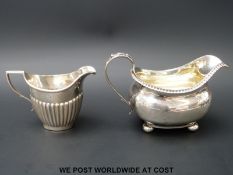 A Georgian hallmarked silver cream jug with gilt interior Ldn 1814, maker's mark rubbed,