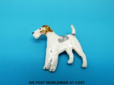 An enamel brooch in the form of a fox terrier, marked Kenart to the back.