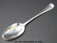A Georgian bottom hallmarked silver table spoon Ldn 1739 maker's mark JJ or JT with horse above,