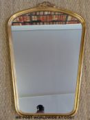 A gilt framed mirror with bow finial (H78 x W53cm)