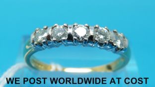 An 18ct gold ring set with five diamonds (size Q)