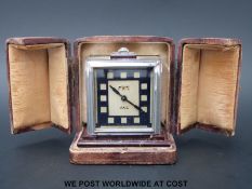 An Art Deco JAZ travel alarm, in original leather travel case, the clock movement Brevete,