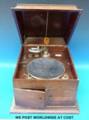 An oak cased wind up gramophone with ivorine label W.
