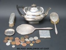 A hallmarked silver hand mirror and two silver backed brushes, a hallmarked silver pin dish,