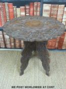 A rustic window seat or similar bench (L89cm) together with a folding carved table