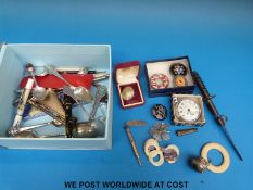 A collection of hallmarked silver items including a baby's rattle, hallmarked baby brooch, cutlery,