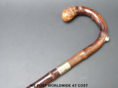 A Brigg walking cane with hallmarked silver gilt collar (Ldn 1889) with a hidden pencil insert to