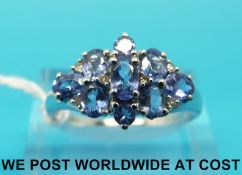 A 9ct white gold ring set with purple topaz (size R)