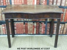 A Georgian mahogany hall table with serpentine front,