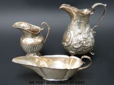 A Victorian hallmarked silver embossed jug,