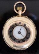 A ladies half hunter yellow metal fob watch with keyless lever movement