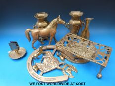 A quantity of brassware to include trivet, horseshoe horse display plaques,